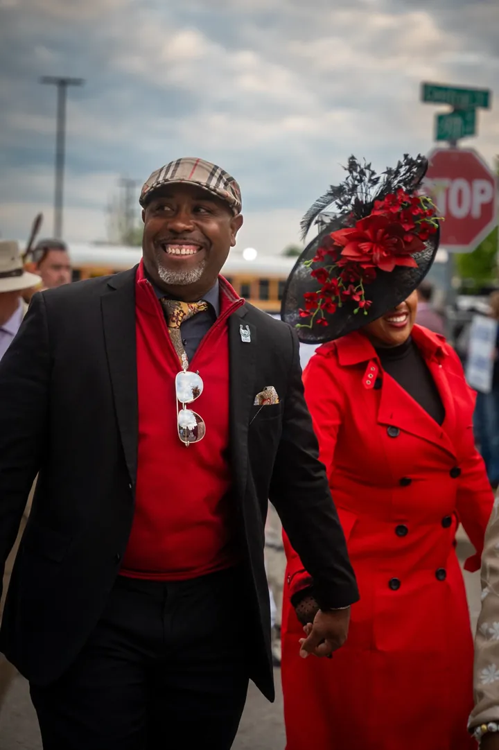 A couple dressed in red on Derby Day